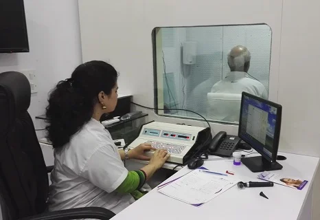 Patient undergoing a hearing test (audiogram) to assess hearing loss